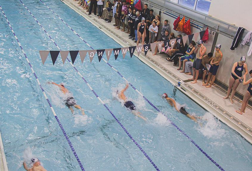 Boy swimmer racing