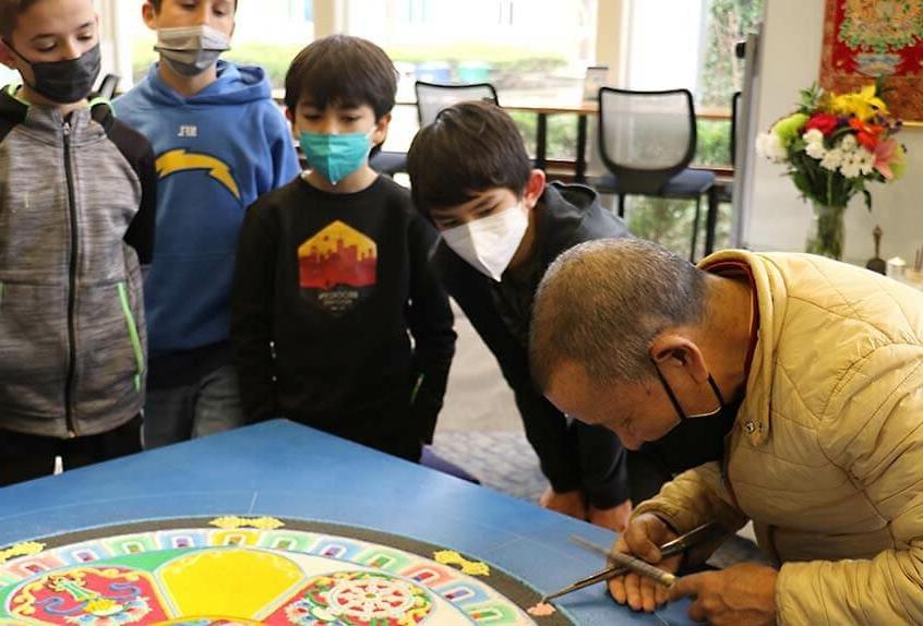 Lama Tenzin working on mandala